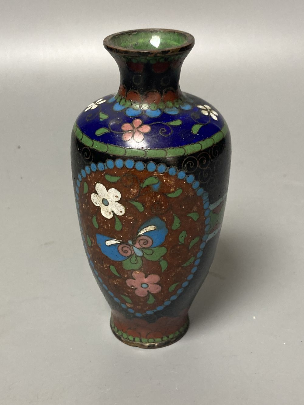 Two Japanese plates, a cloisonne vase and a seal paste box, largest 24.5cm